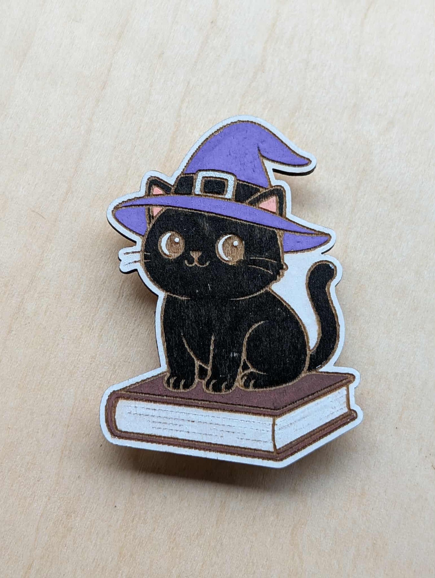Black Cat on a Book Magnet