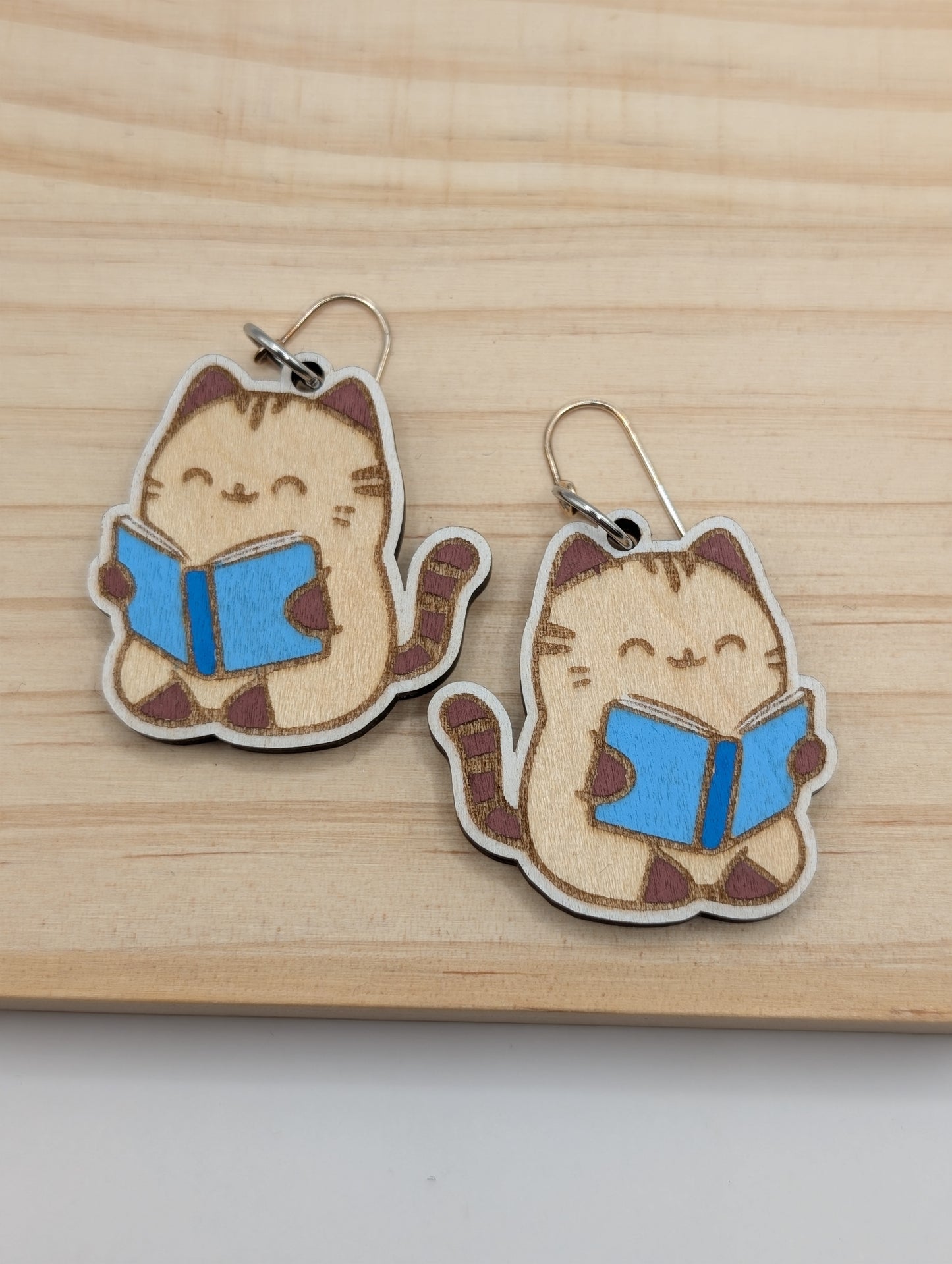 Neutral Cat Reading Dangles