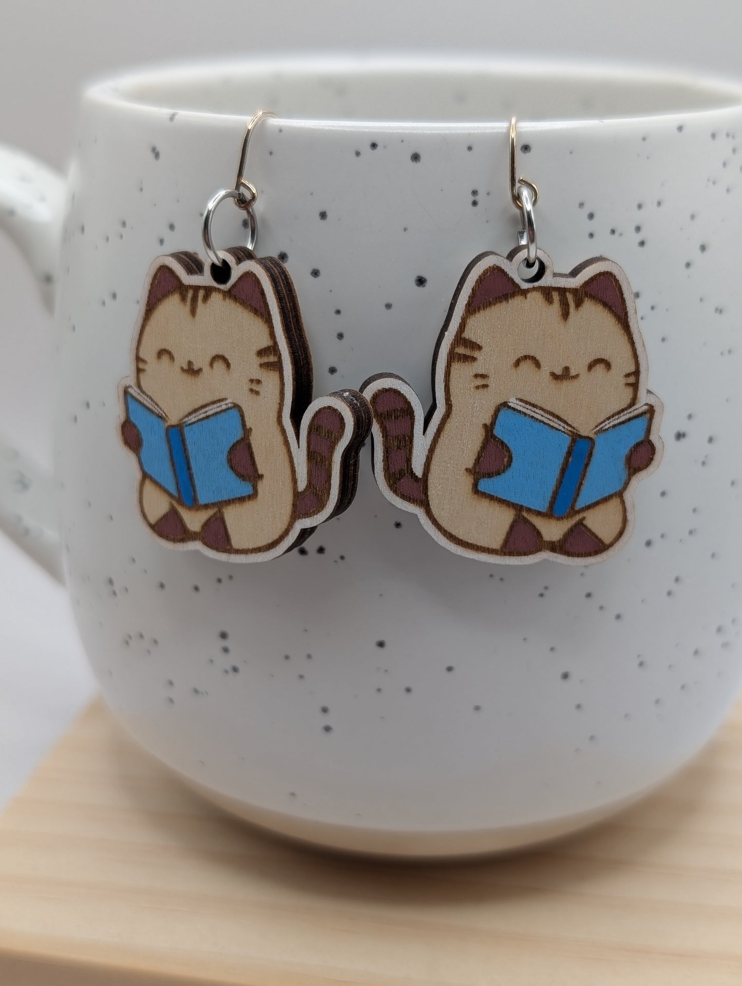 Neutral Cat Reading Dangles